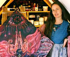 Nanette Lloay with one of her paintings